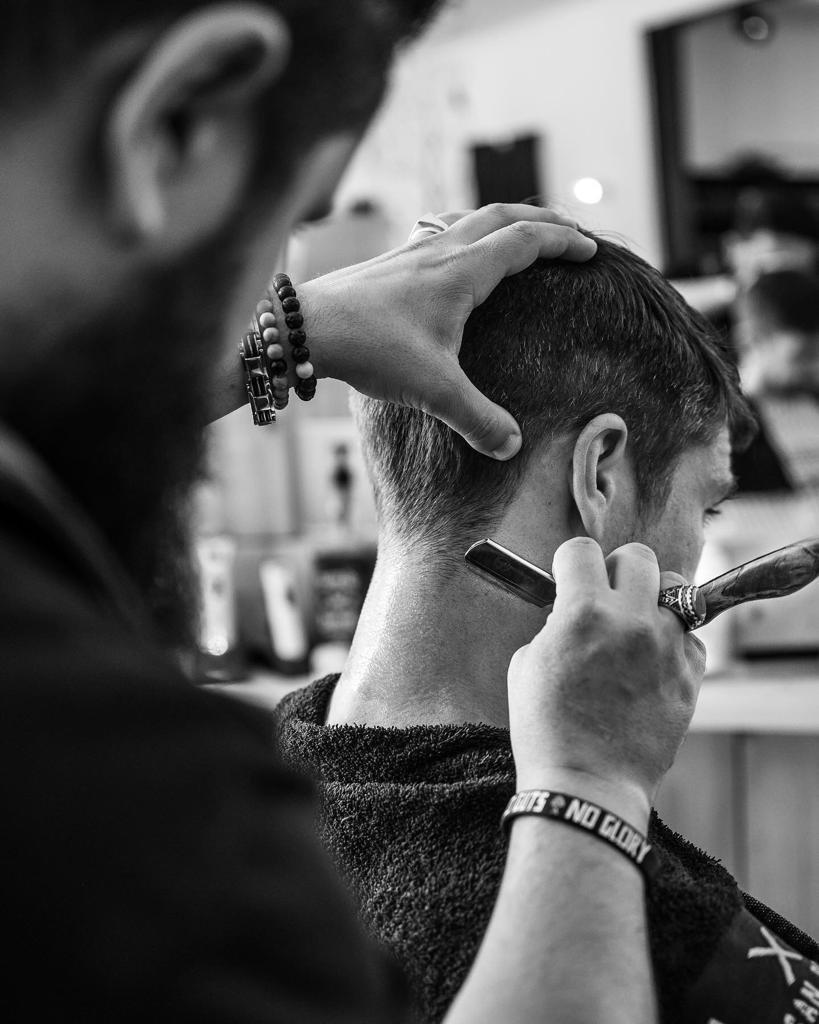 Hardi the barber at work